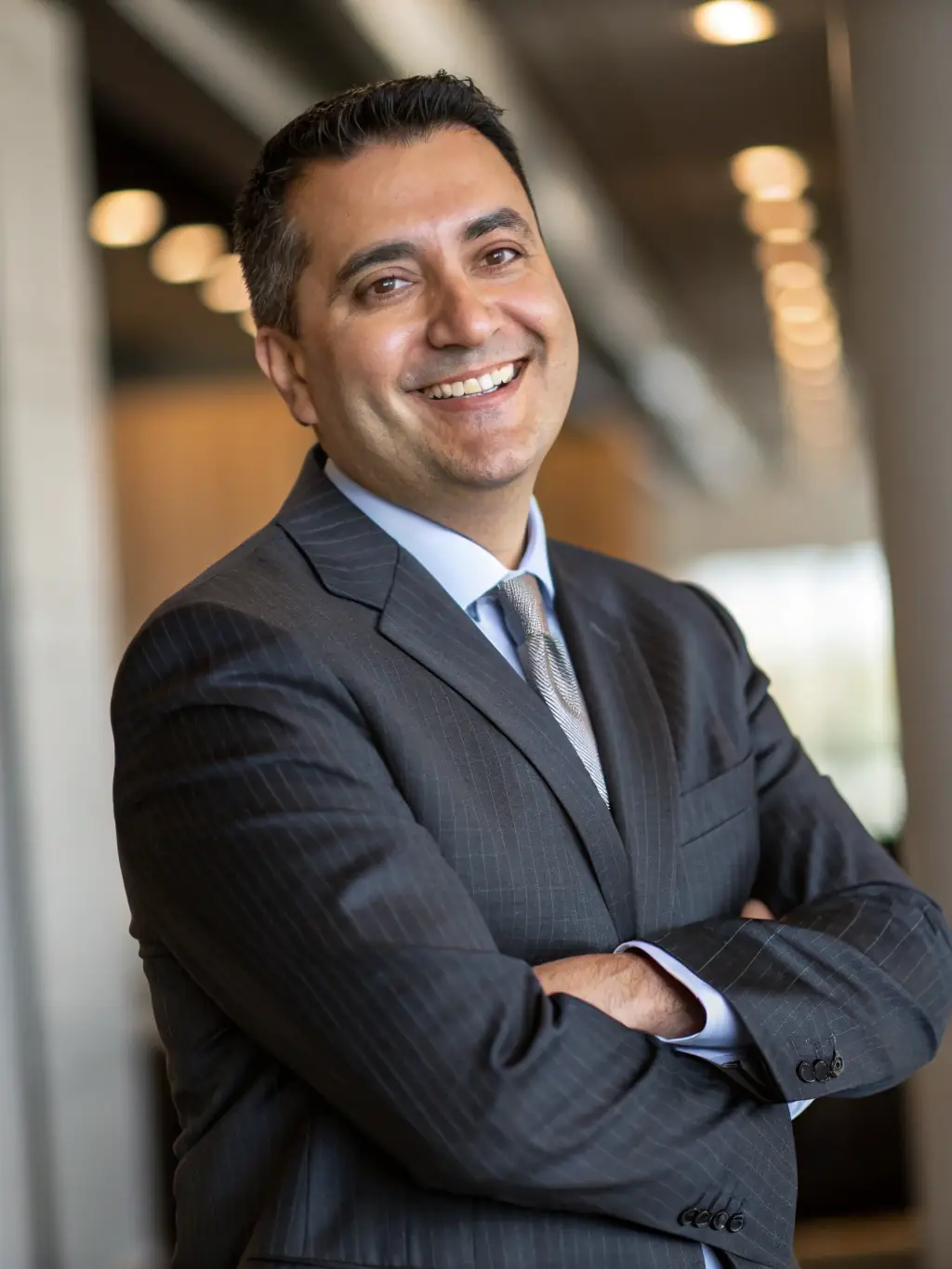 A professional headshot of a successful Fintek Club graduate, showcasing the importance of a strong personal brand and professional presentation.